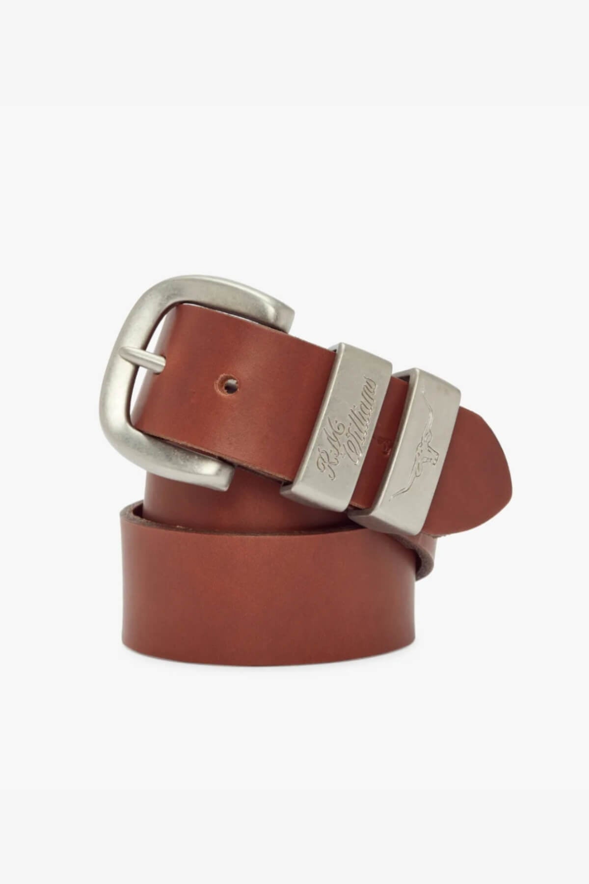 The RM Williams 1 1/2 3 Piece Solid Hide Belt is a brown leather belt with a brushed nickel buckle and two embossed loops, crafted from solid hide leather in Australia, with all features neatly coiled for display.