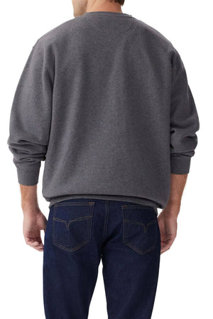 A person is shown from the back wearing a charcoal gray RM Williams Bale Sweatshirt made from organic cotton fleece and dark blue jeans, set against a white background.