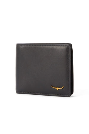 The RM Williams Bi Fold Wallet with Pocket, crafted from black full-grain leather, features RFID protection and a small gold longhorn emblem in the bottom right corner. It's shown closed and upright against a white background.