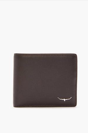 The RM Williams City Slim Bi-Fold is a sleek wallet crafted from rich full-grain leather, showcasing a silver bull emblem in the lower right corner. Its dark brown finish contrasts elegantly with a plain white background and includes multiple card slots for convenience.