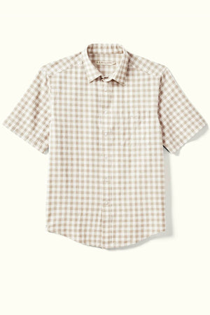 The RM Williams Classic Short Sleeve Shirt showcases a beige and white gingham pattern on a light background with its short sleeves and button-up design.