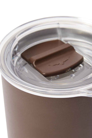 Close-up of the brown RM Williams Coffee Cup with a transparent lid featuring a sliding closure, partially open to reveal the seal. The stainless steel cup has a matte finish, emphasizing its design as an eco-friendly choice for sustainability-focused consumers.