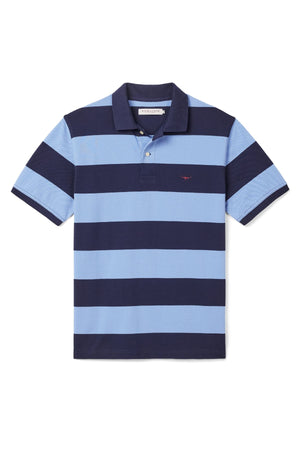 The RM Williams Craddle Polo features wide navy and light blue stripes, a collar, three-button placket, subtle Longhorn embroidery, and is made from soft organic cotton for both comfort and style.