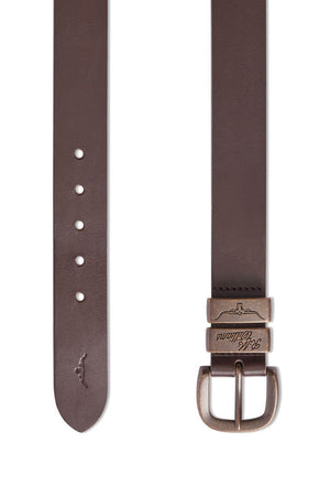 An RM Williams Drover Belt in brown leather is displayed in two positions, fully extended and partially coiled. The belt features an antique brass buckle and multiple adjustment holes. Made from vegetable-tanned leather, the end of the belt has an embossed logo of a kangaroo along with the text "Slick Collar.