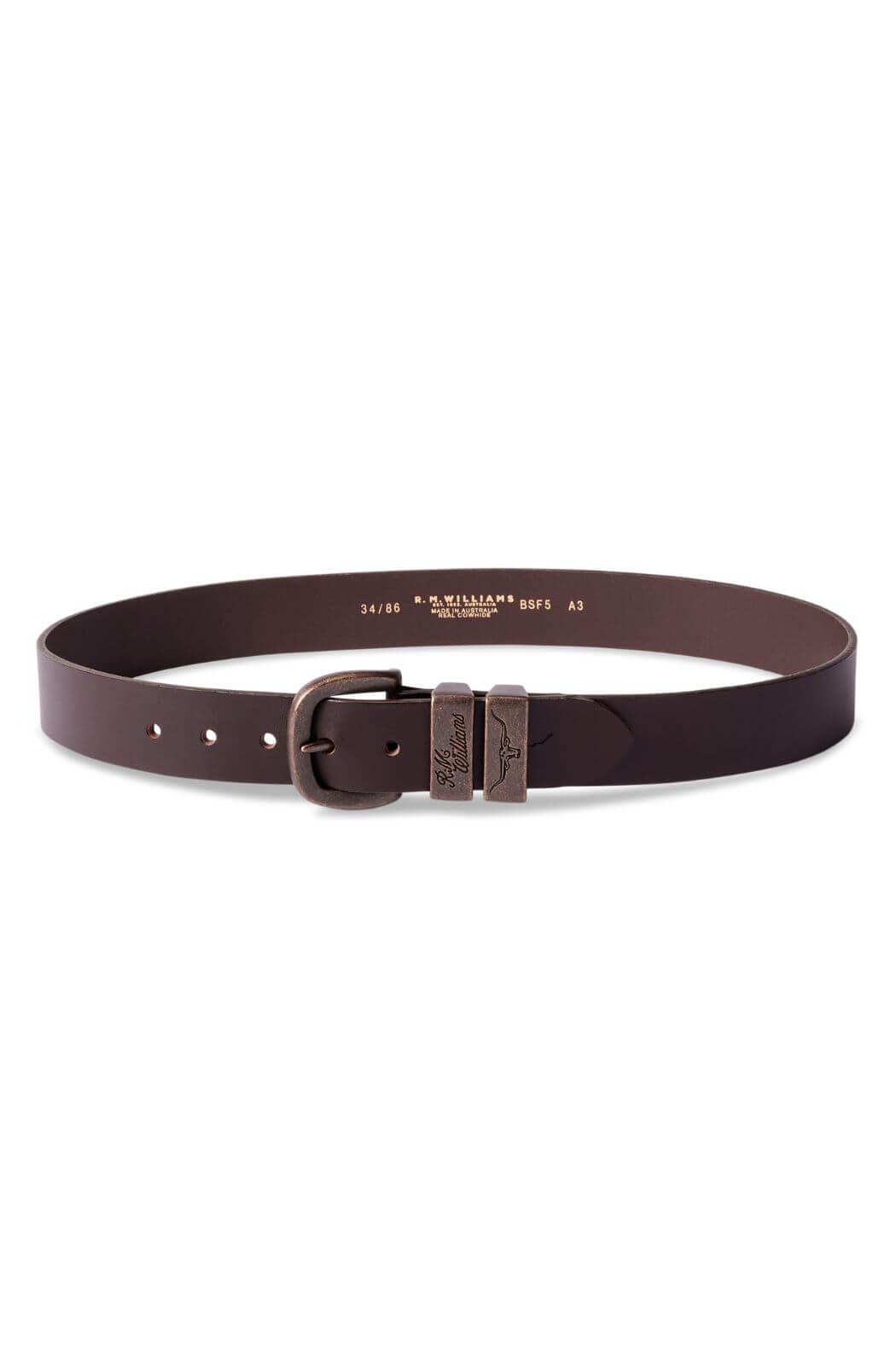 The RM Williams Drover Belt, made from vegetable-tanned leather in a dark brown hue, showcases a rectangular antique brass buckle. It exudes a simple, classic design with multiple adjustment holes and embossed branding near the buckle. Inside, you'll find size and branding information displayed in gold text.