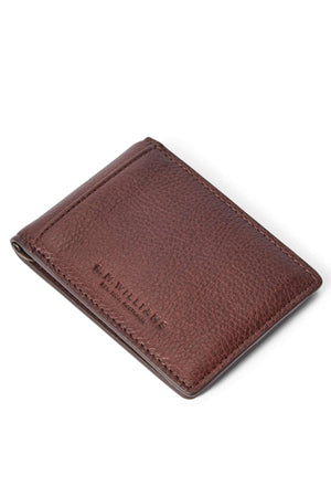 The RM Williams Farrier Bi Fold Clip Wallet is a brown textured leather cardholder with "R.M.WILLIAMS" embossed on the front, shown on a white background.