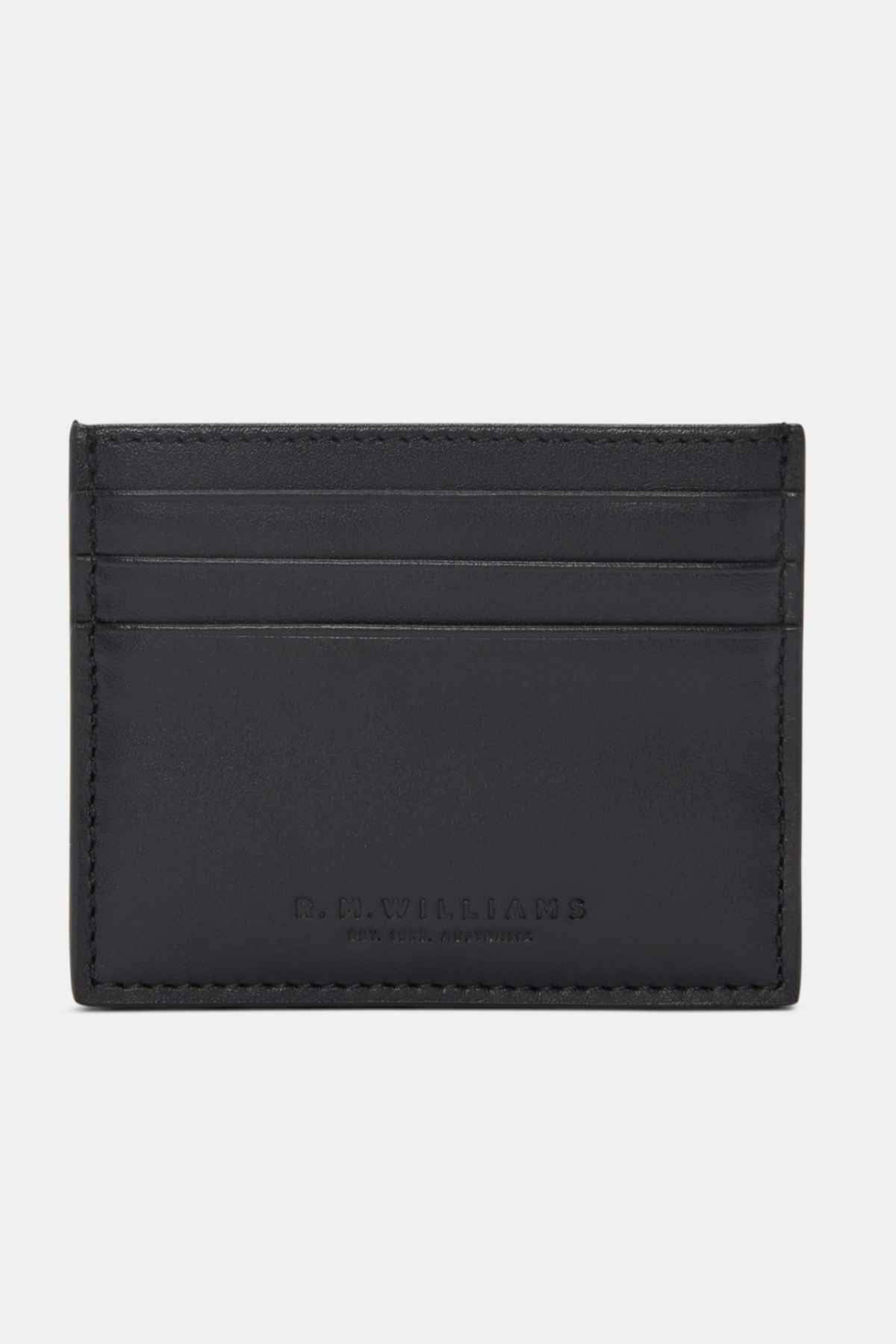 The RM Williams Farrier Card Holder in black premium leather features four card slots and subtle embossed front branding, displayed on a plain white background.