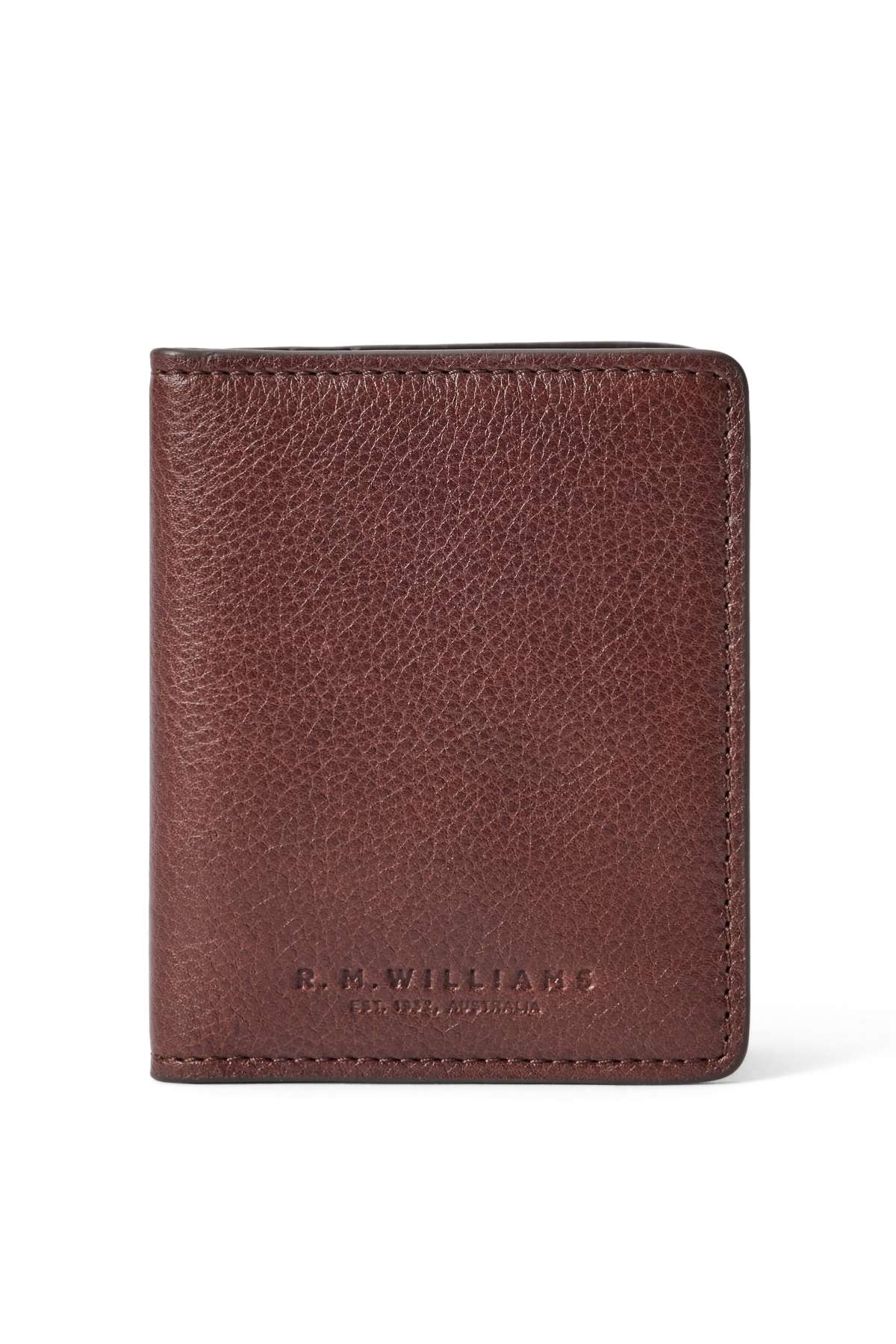 A brown leather RM Williams Farrier Fold Cardholder with a textured finish and "R.M. Williams" embossed in gold near the bottom right corner on the front.