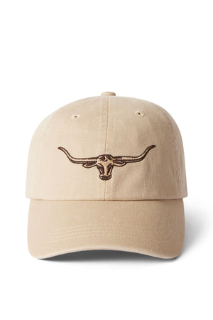 The RM Williams Longhorn Twill Cap is beige with a dark brown embroidered steer head on the front, made from organic cotton twill, and has an adjustable strap. Shown on a white background.