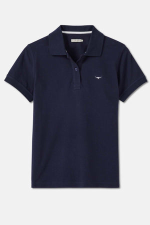 The RM Williams Margaret Polo is a navy blue cotton shirt with short sleeves and a small white whale logo on the left chest. Made from organic cotton, it features a classic collar and a front button placket with two buttons. Perfect for those who appreciate R.M.Williams' quality and design.