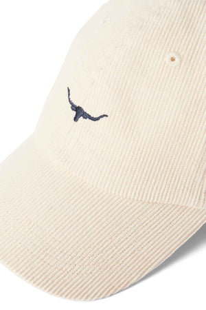 RM Williams Mini Longhorn Cord Cap in the colour cream. Close up of front of cap