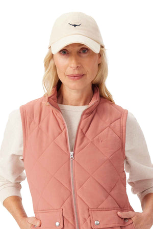 RM Williams Mini Longhorn Cord Cap in the colour cream. Woman modelling cap
