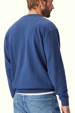 RM Williams Mini Longhorn Sweatshirt in the colour French. Back angle of model wearing jumper