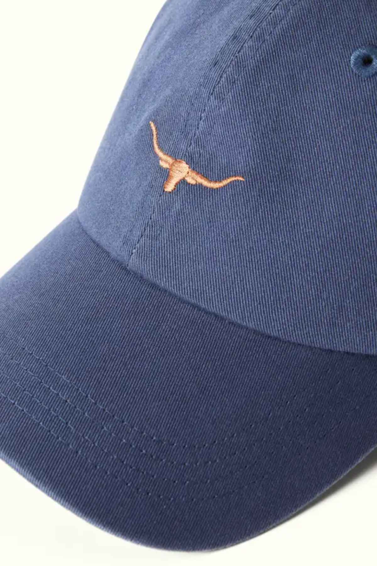 RM Williams Mini Longhorn Cap in the colour indigo. Close up of Long horn embroidery on front