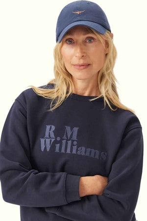 RM Williams Mini Longhorn Cap in the colour indigo. Woman modelling cap