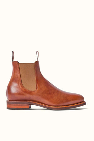 The RM Williams Moriarty Rubber Sole Boot showcases pull-up leather and an almond toe, completed with a brown fabric finish.