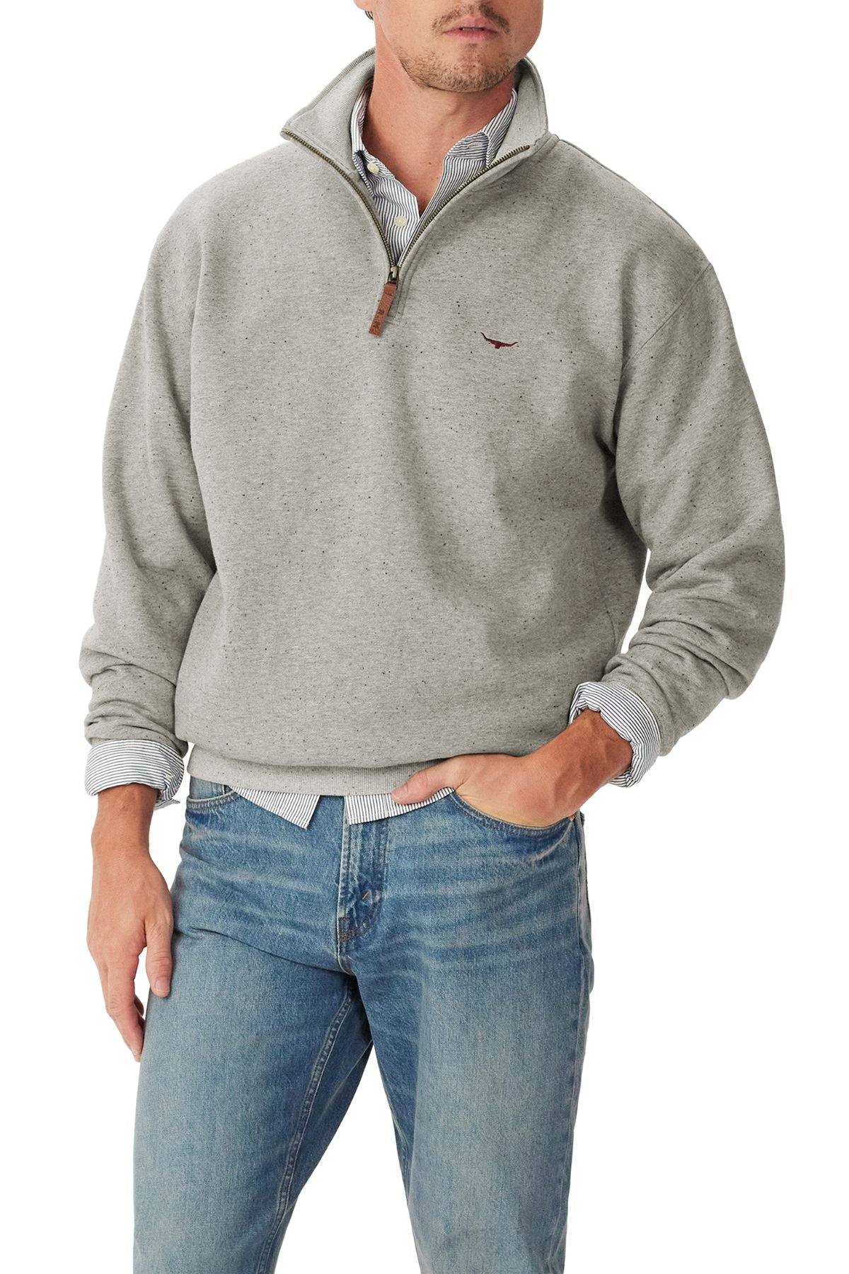 A man wearing an RM Williams Mulyungarie 1/4 Zip Sweatshirt in light gray over a collared shirt and blue jeans, with one hand in his pocket. The sweatshirt features a small embroidered logo on the chest.