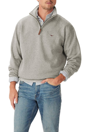 A man wearing an RM Williams Mulyungarie 1/4 Zip Sweatshirt in light gray over a collared shirt and blue jeans, with one hand in his pocket. The sweatshirt features a small embroidered logo on the chest.