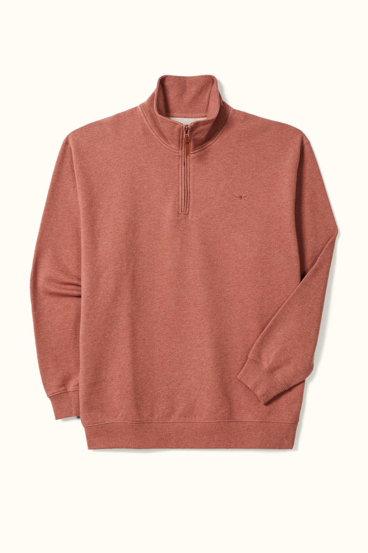 The RM Williams Mulyungarie Fleece is a rust-colored, quarter-zip pullover with long sleeves and ribbed cuffs, made from French cotton terry. The soft fabric showcases a small logo on the chest and is displayed laid flat against a white background.