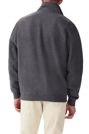 A person wearing an RM Williams Mulyungarie Fleece quarter-zip sweatshirt in dark gray with light beige pants is shown from the back against a white background.