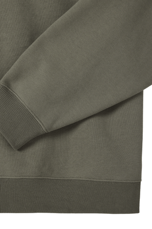 Close-up of the sleeve and hem of the olive green RM Williams Mulyungarie Fleece, highlighting ribbed cuffs, waistband, and its smooth brushed cotton fleece texture.