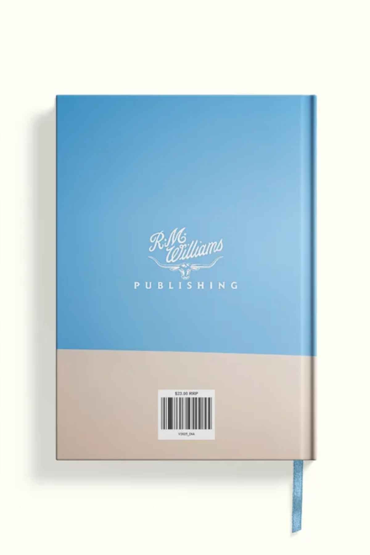 The RM Williams Outback Diary 2025 is a blue and beige hardcover with a ribbon bookmark, "R.M. Williams Publishing" in white script, a $23.99 barcode, and features stunning photos of Australia throughout.
