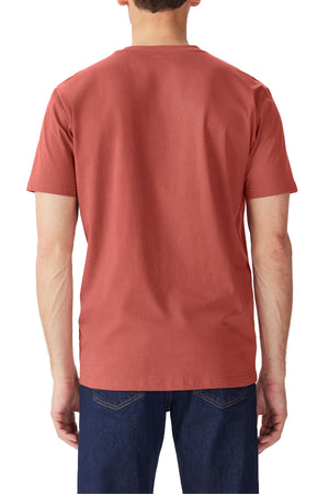 A man is shown from the back against a white background wearing the RM Williams Parson T-Shirt in rust, with a regular fit and short sleeves, made from organic cotton jersey, paired with dark blue jeans.
