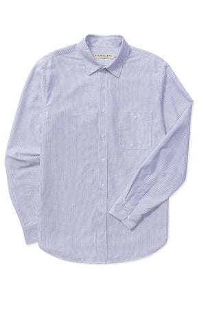 The RM Williams Regular Shirt is a blue and white striped long-sleeve button-up made from organic cotton, featuring a chest pocket, classic collar, and buttoned cuffs. This shirt merges timeless style with eco-friendly comfort.