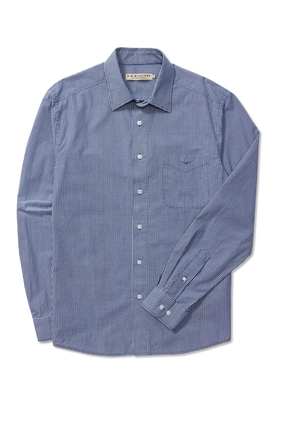 The RM Williams Classic Shirt is a long-sleeve, button-up shirt featuring a micro gingham check pattern in blue and white. This shirt includes a front chest pocket and a standard collar, crafted from lightweight fabric perfect for both casual and semi-formal occasions.