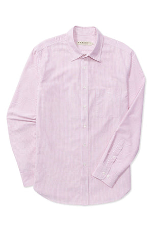The RM Williams Regular Shirt is a slim regular-fit, long-sleeve button-down with a collar, featuring thin pink and white vertical stripes. Made from organic cotton, it's neatly laid flat with fastened buttons and a slightly bent left sleeve.