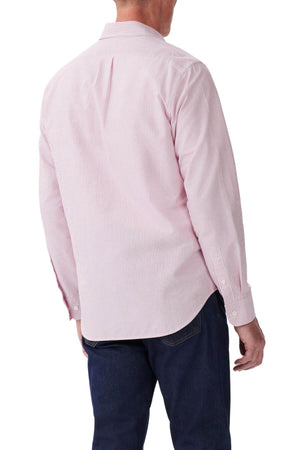 A man shown from the back against a white background wears an RM Williams Regular Shirt in light pink and white stripes with long sleeves, paired with dark blue jeans.