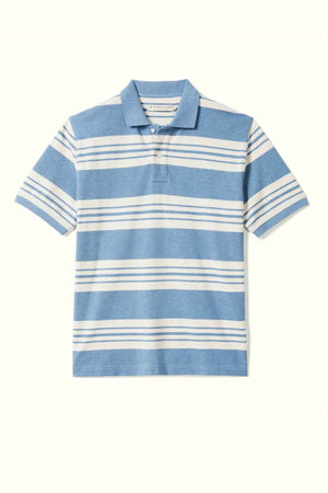 The RM Williams Rod Polo is a blue short-sleeve shirt featuring horizontal white stripes of varying thicknesses across the chest and sleeves. Crafted from breathable cotton pique, it comes with a collar, a two-button placket, and classic longhorn embroidery on the chest for added style.