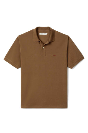 The RM Williams Rod Polo is a short-sleeved brown shirt with a collar, two-button placket, and an embroidered logo on the left chest, displayed flat on a white background.