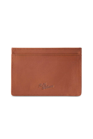 The RM Williams Singleton Vertical Card Holder is made from natural milled brown leather, features a stitched border, a front card slot, and has the "R.M. Williams" logo embossed at the center.