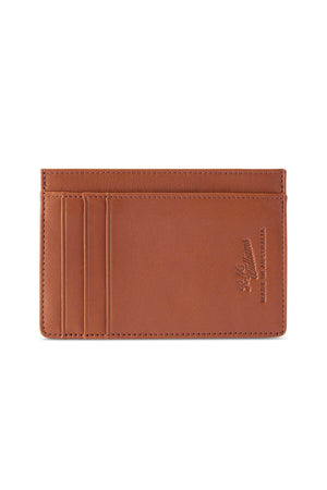 The RM Williams Singleton Vertical Card Holder is a slim brown accessory made from natural milled leather, featuring three card slots and subtle embossed branding on the lower right corner, shown against a white background.