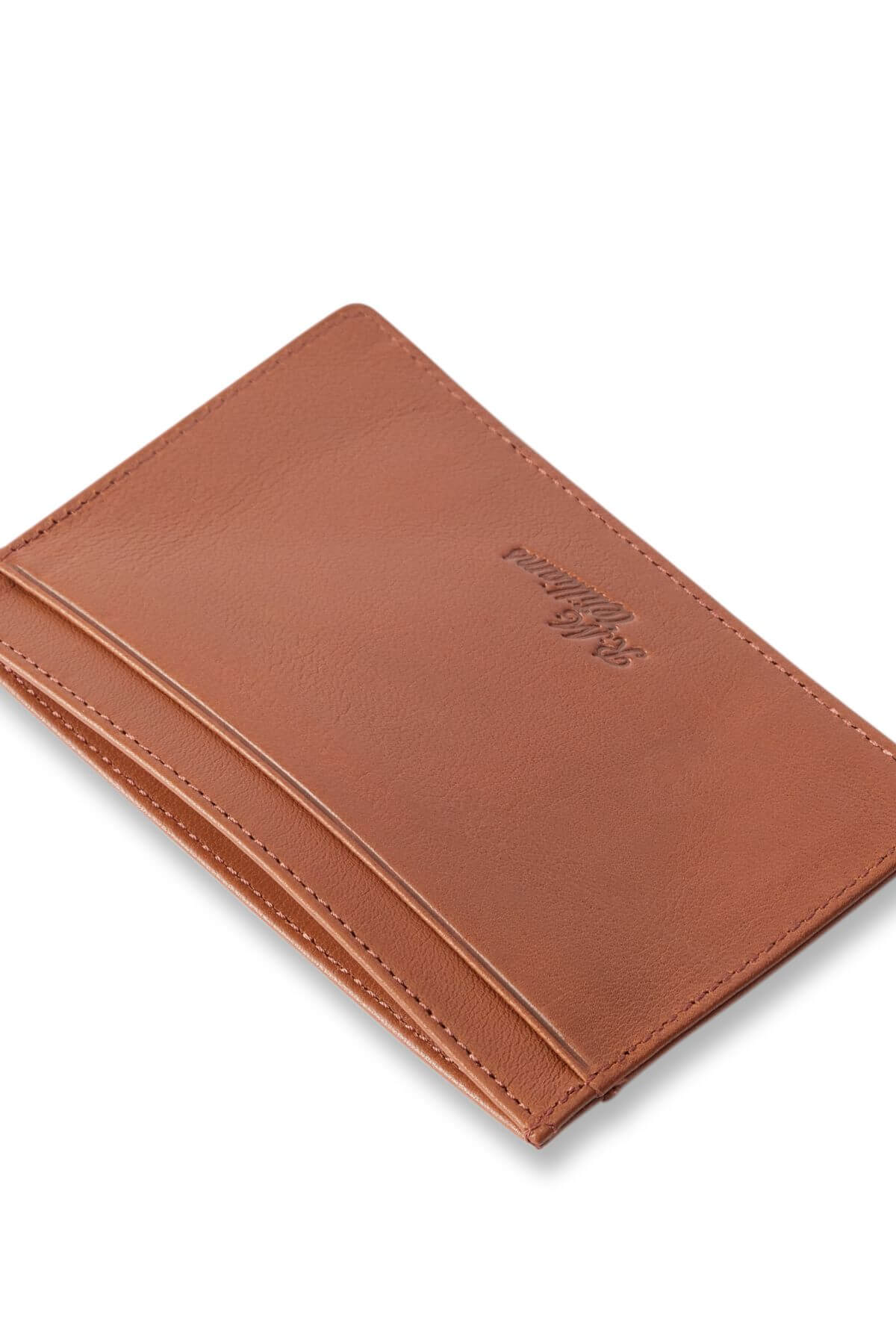 The RM Williams Singleton Vertical Card Holder features natural milled brown leather, a slim profile, minimalist embossed logo, and visible edge stitching, shown on a white background.