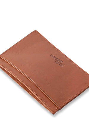 The RM Williams Singleton Vertical Card Holder features natural milled brown leather, a slim profile, minimalist embossed logo, and visible edge stitching, shown on a white background.