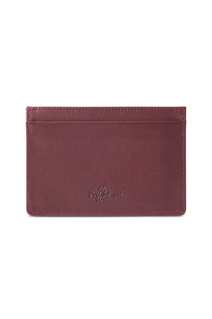 The RM Williams Singleton Vertical Card Holder is a slim, rectangular leather wallet in a rich brown color, featuring minimal stitching and a small embossed logo in the center of one side. Handmade in Australia from natural milled leather, it has one central pocket and several card slots for organization, along with RFID protection.