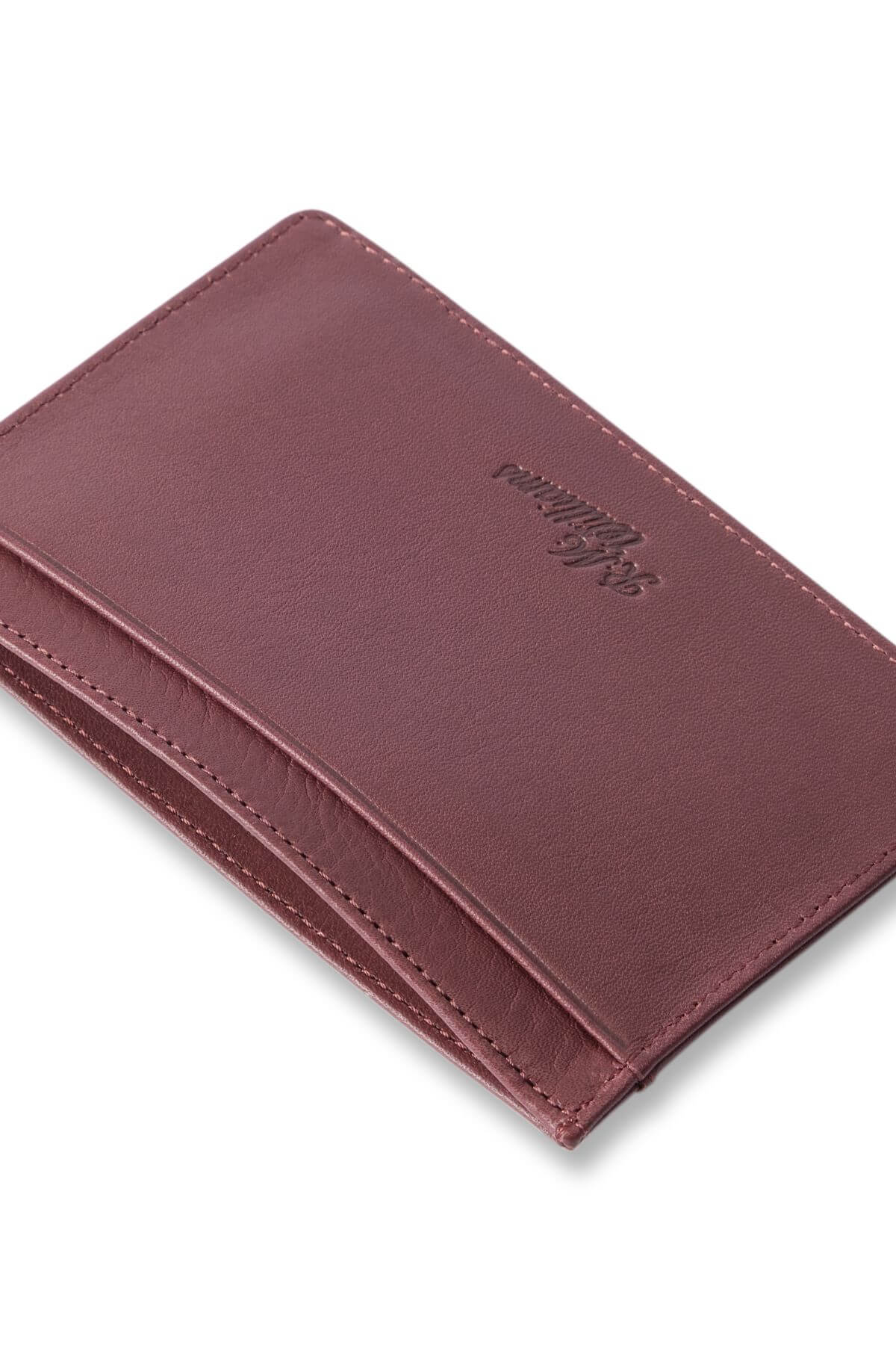 The RM Williams Singleton Vertical Card Holder, handcrafted in Australia from natural milled leather, is showcased against a white background. The wallet, empty and minimalist in design, features clean lines and a smooth texture. The brand's logo is embossed on the front.