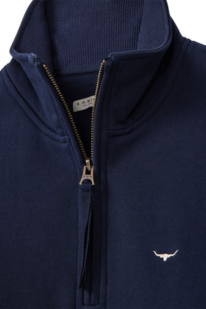 Close-up of the RM Williams Trickett Zip Neck Sweatshirt in navy Cotton Terry, with a silver zipper, Longhorn embroidery on the chest, and a visible "R.M. Williams" label inside the collar.