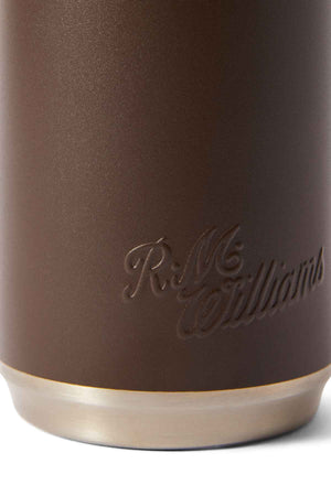 Close-up of the RM Williams Vacuum Flask with a brown textured surface, embossed cursive "R.M. Williams," and a lighter, metallic edge inspired by stainless steel design.