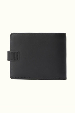 The RM Williams Wallet with Pocket and Tab is shown closed in black Yearling leather, featuring a snap tab closure and visible edge stitching, set against a plain light background.
