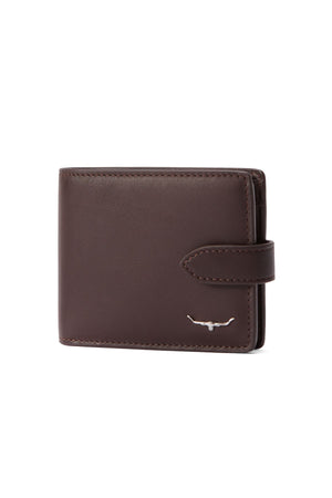 The RM Williams Wallet with Pocket and Tab features full-grain leather, card slots, a snap closure strap, RFID protection, and a small silver bull logo on the bottom right corner.