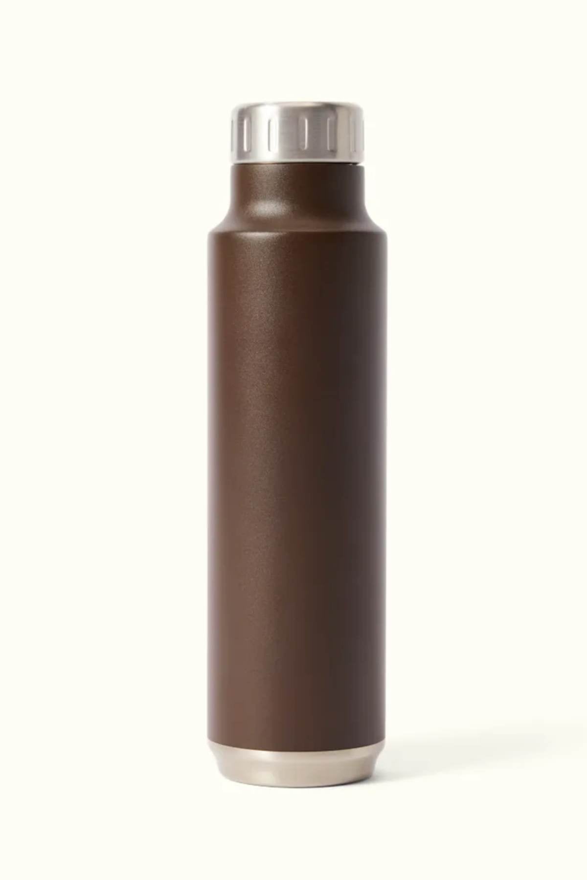 The RM Williams Water Bottle, a sleek, brown BPA-free stainless steel design with vacuum insulation and a silver cap, stands upright against a plain beige background.