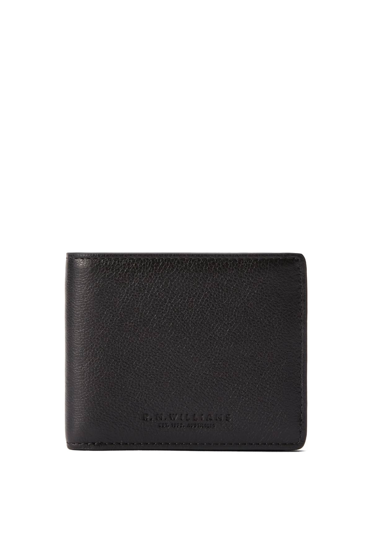 The RM Williams Farrier Slim Bi Fold Wallet is crafted from black full grain leather with a subtle grain texture, minimal stitching, multiple card slots, and "R.M.Williams" embossed near the bottom center.