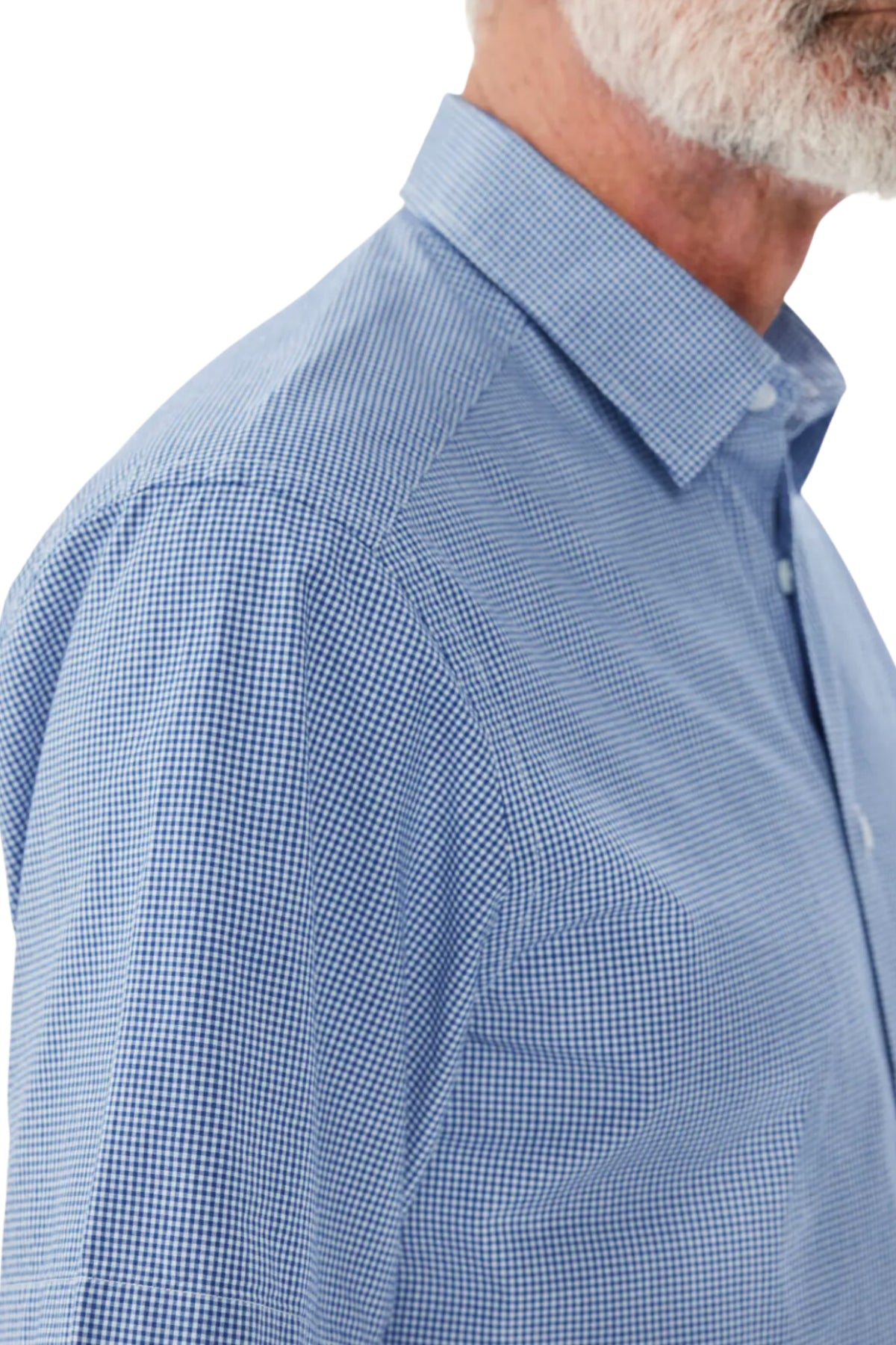 Close-up of an older man with a white beard wearing the RM Williams Hervey Shirt in blue and white checkered pattern, made from breathable cotton. The image focuses on the collar and upper torso of the shirt, showcasing the detailed pattern and fabric texture. Ideal for year-round wear, the background is plain white.