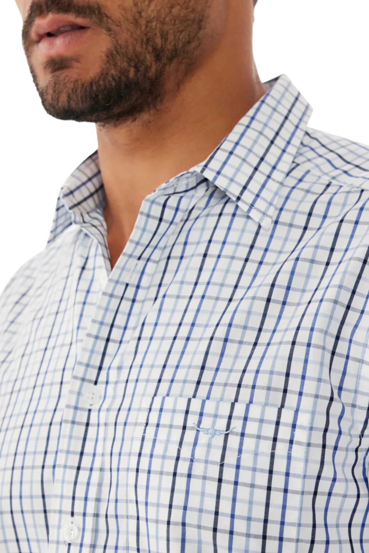 A man wears the RM Williams Hervey Shirt, a light blue and white plaid short-sleeve cotton button-up with a collar; part of his face, neck, and chest are visible against a white background.