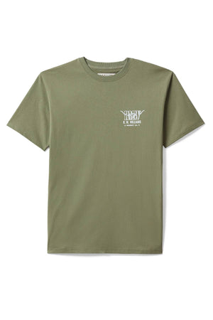The RM Williams Prospect T-Shirt is a plain olive green tee with a ribbed crew neck, short sleeves, and a small white logo and text on the left chest, displayed flat on a white background.