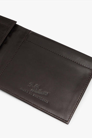 Close-up of an open RMW Singleton Wallet with Coin Pouch, crafted from embossed calf leather and adorned with "Made in Australia." This sophisticated accessory features RFID protection, offering both style and security.