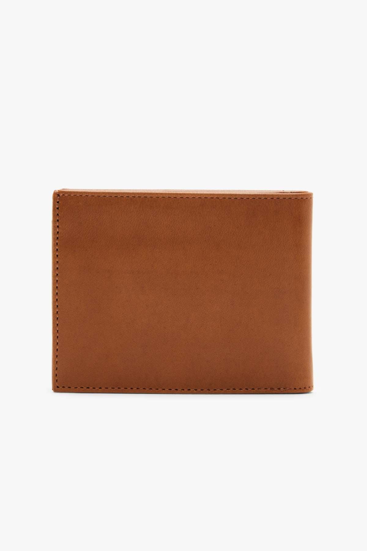 A close-up image of the RMW Singleton Wallet with Coin Pouch, made from closed brown calf leather, against a plain white background. The wallet features a smooth texture and simple design, highlighted by visible stitching along the edges that offers sleek elegance.